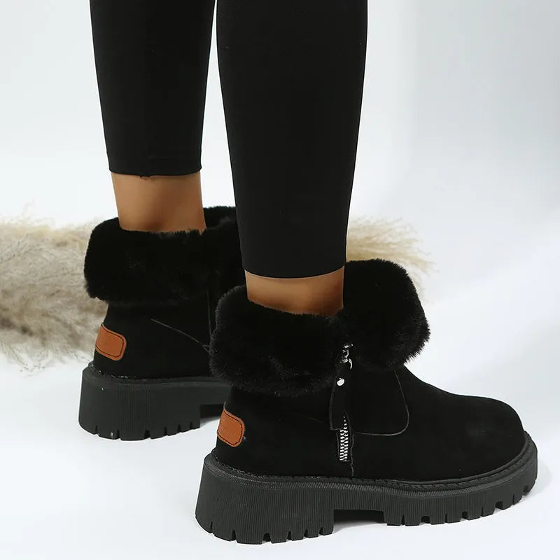 Women's black high-top snow boots with side zipper and round toe, made from cow suede.