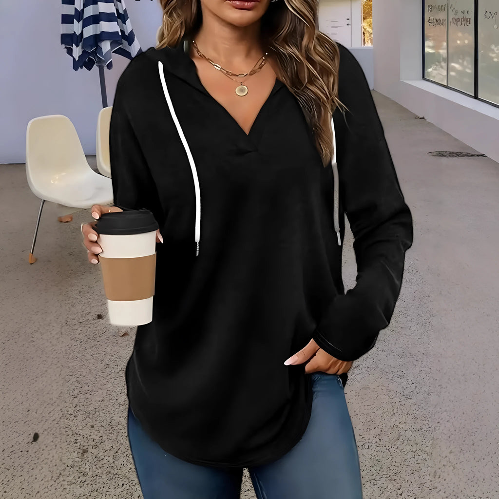 Women's red V-neck hooded sweatshirt with long sleeves on a hanger.