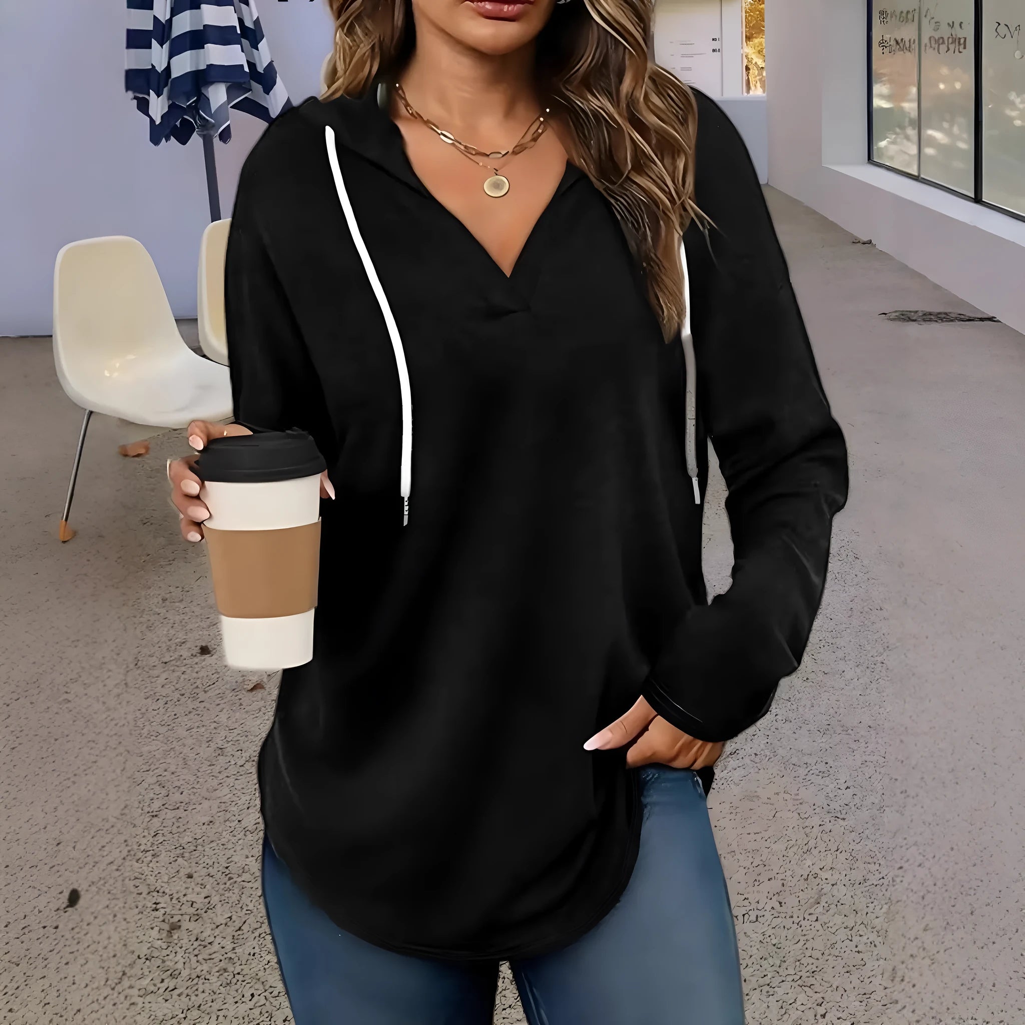 Women's red V-neck hooded sweatshirt with long sleeves on a hanger.