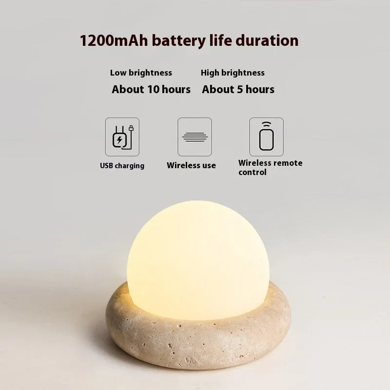 Cream modern bedside night light with remote control on wooden table