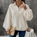 Women's milky white polo collar sweater with long sleeves and textured fabric.