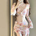 Women's cherry blossom pink floral bikini swimsuit laid flat.