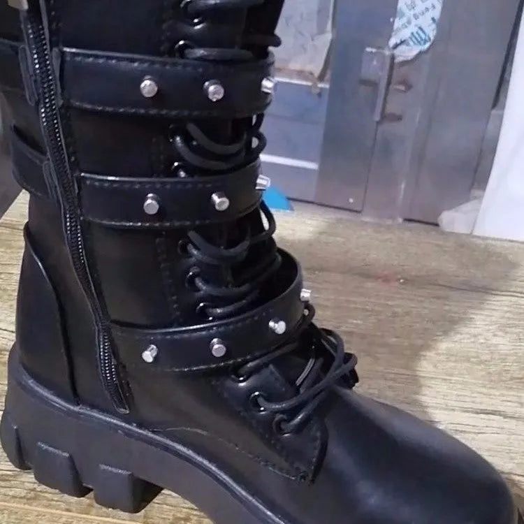 Women's black mid-calf knight boots with metal buckle and side zipper on a white background.