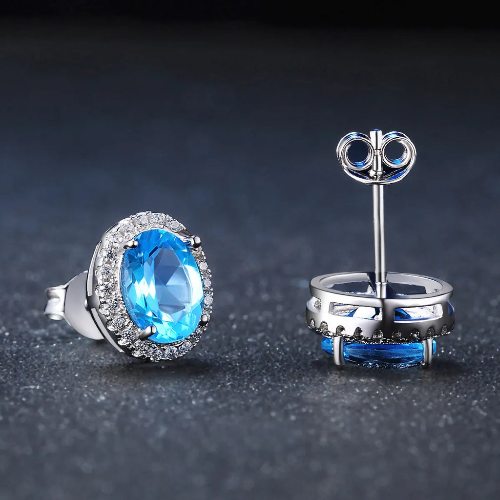 925 sterling silver jewellery set with Blue Topaz stones in geometric design including earrings, ring, pendant and necklace