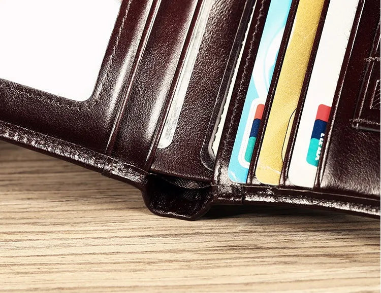 Men's leather wallet open showing photo slot, card holders, banknote section and change compartment