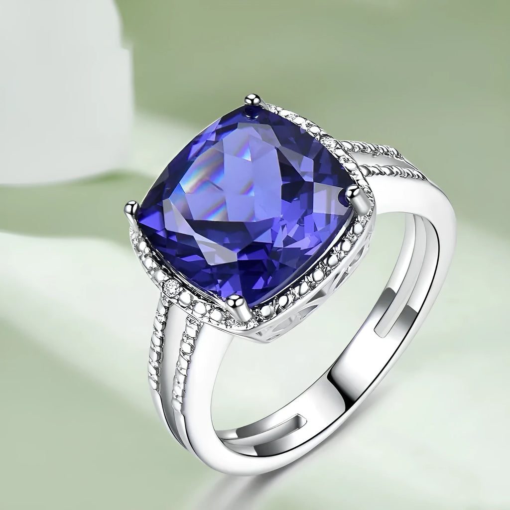 Women's sterling silver ring with blue tanzanite gemstone showing silver band and stone setting