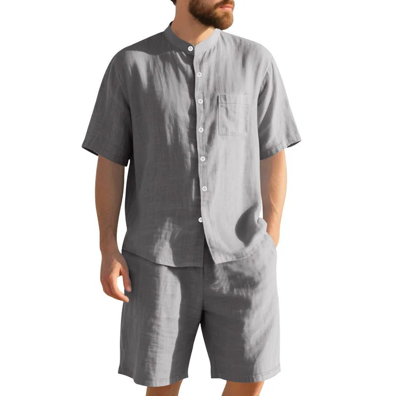 Men's light blue linen blend summer suit with henry collar shirt and shorts on a hanger.