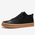 Men's black casual leather shoes with round toe, flat heel, and lace-up front on a white background.
