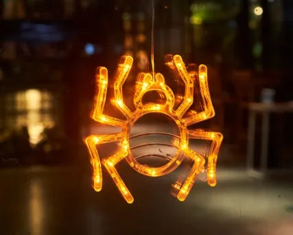 Seven Halloween themed battery-operated LED hanging lights with spider, pumpkin and ghost designs