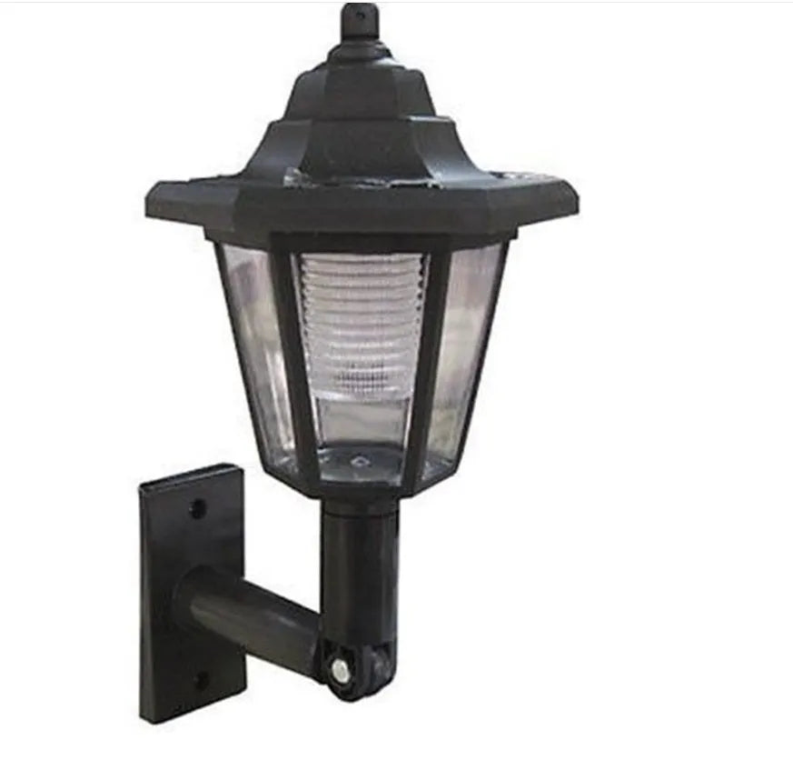 Black hexagonal solar-powered wall light with automatic sensor for outdoor garden or patio lighting