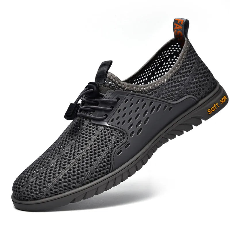Men's black casual shoes with breathable mesh upper and elastic band closure on a white background.