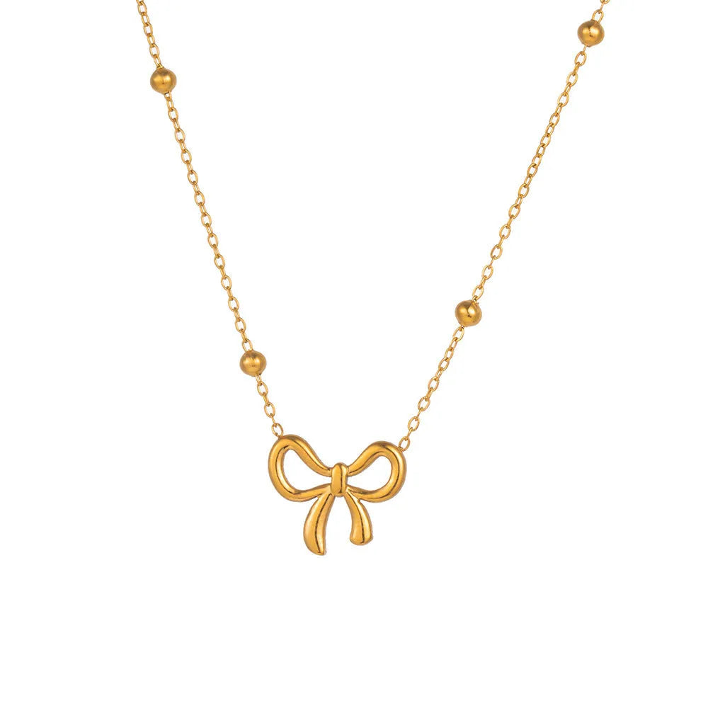 Gold titanium steel bow necklace with cross chain design, adjustable 41-50cm length