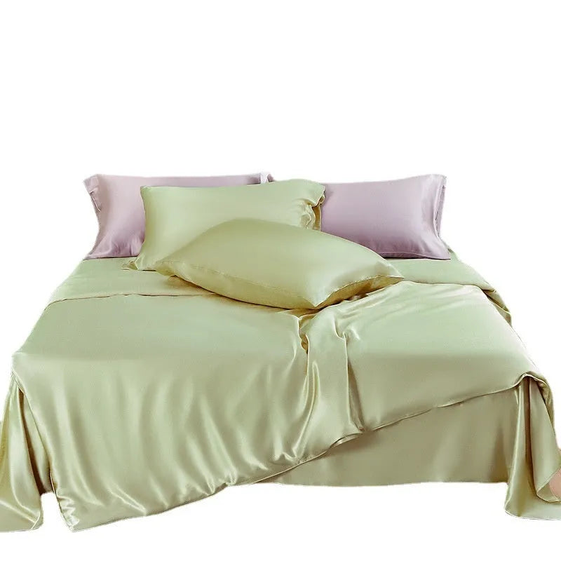 Double-sided solid colour silk duvet cover in bright brown laid flat on a bed.