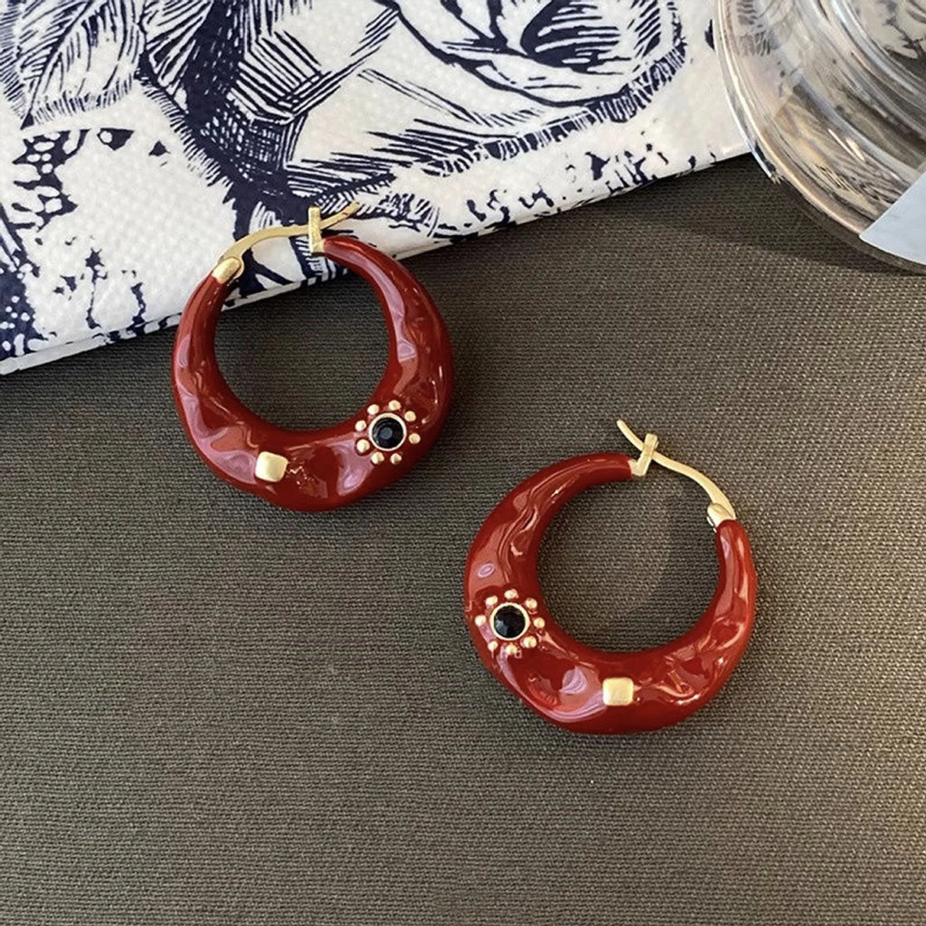 Retro alloy ear studs with dripping oil texture and rhinestone decorations in black or red colours