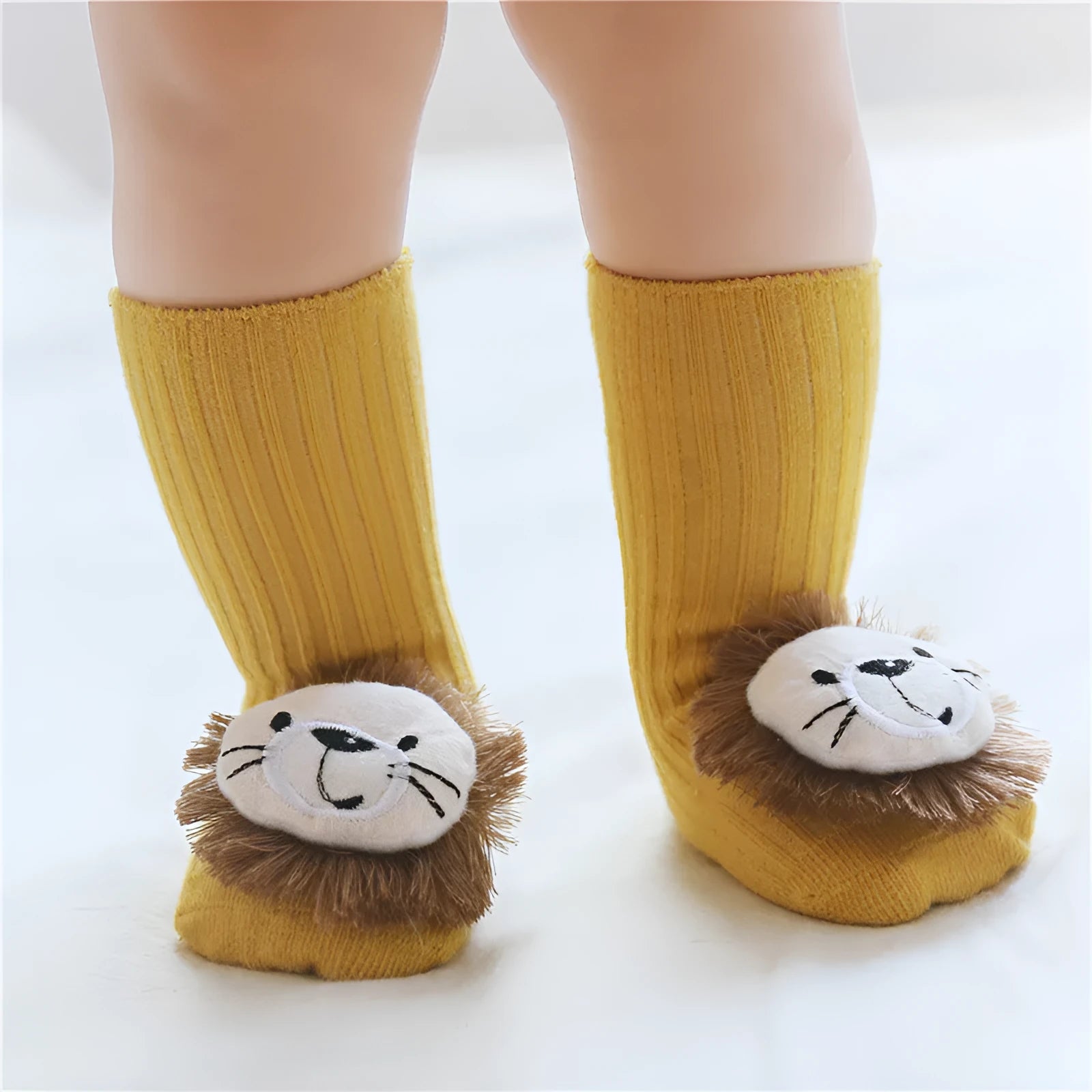 Cotton baby floor socks with non-slip soles in a pink bow print design.