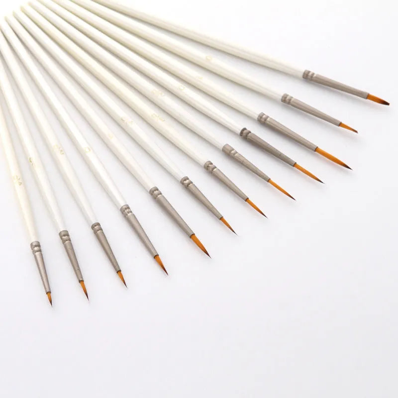 Set of twelve pearl white fluorescent marker pens with nylon wool brush tips and solid wood holders for watercolour art.