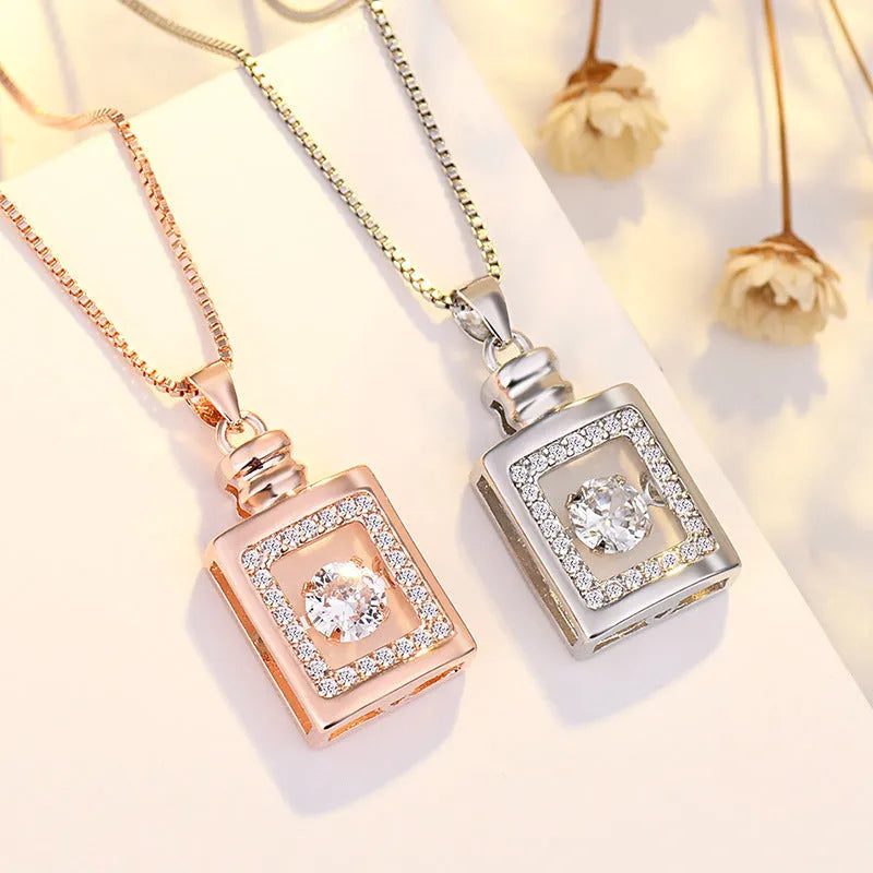 Silver heart-shaped pendant necklace with crown and bow charms for women