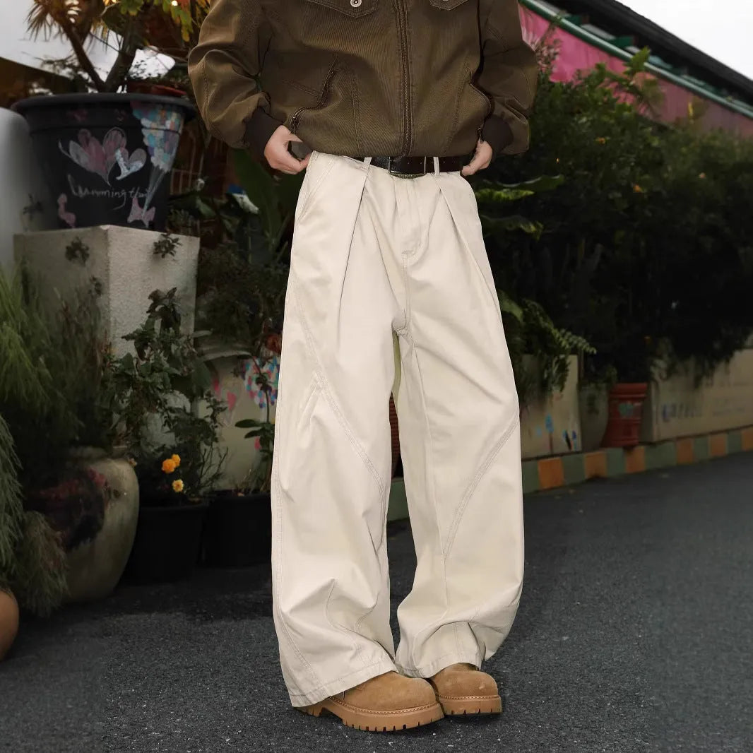 Men's loose-fit pleated trousers in a striped pattern, shown in apricot colour with a straight leg.
