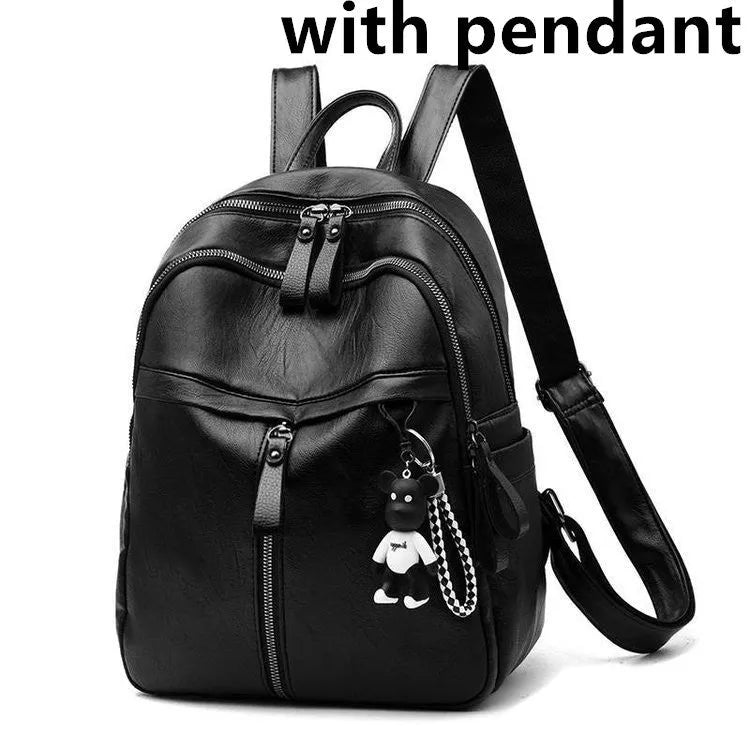 Black soft surface PU leather backpack showing medium size with shoulder straps and luggage strap attachment