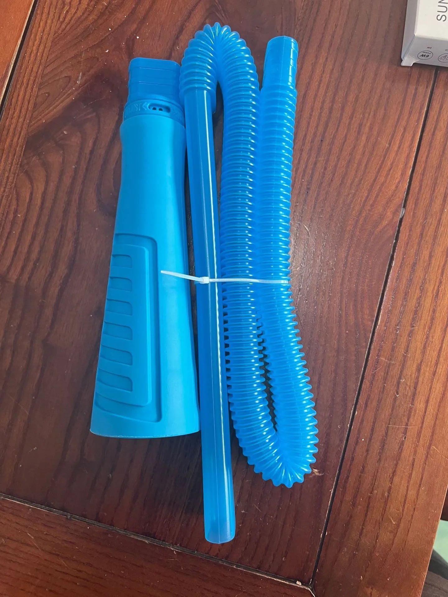 Blue plastic suction pipe vacuum cleaner head attachment with round design measuring 114cm length