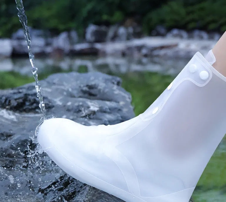 White high-top PVC waterproof reusable shoe covers for women, shown alongside size chart