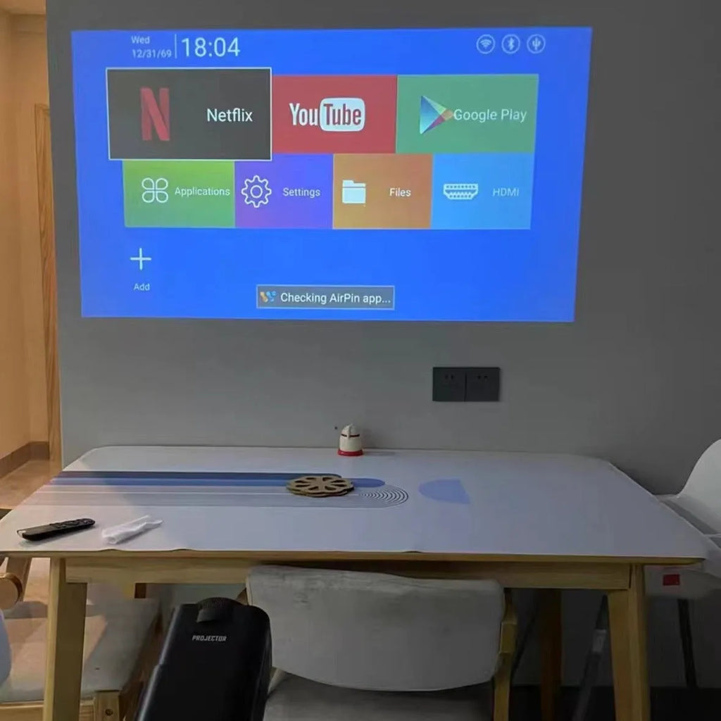 720p wireless home projector with carrying handle on white background