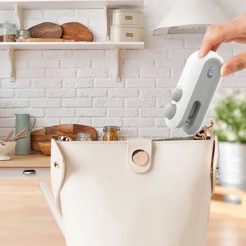 White portable handheld heat sealer with magnetic back for chip bag sealing