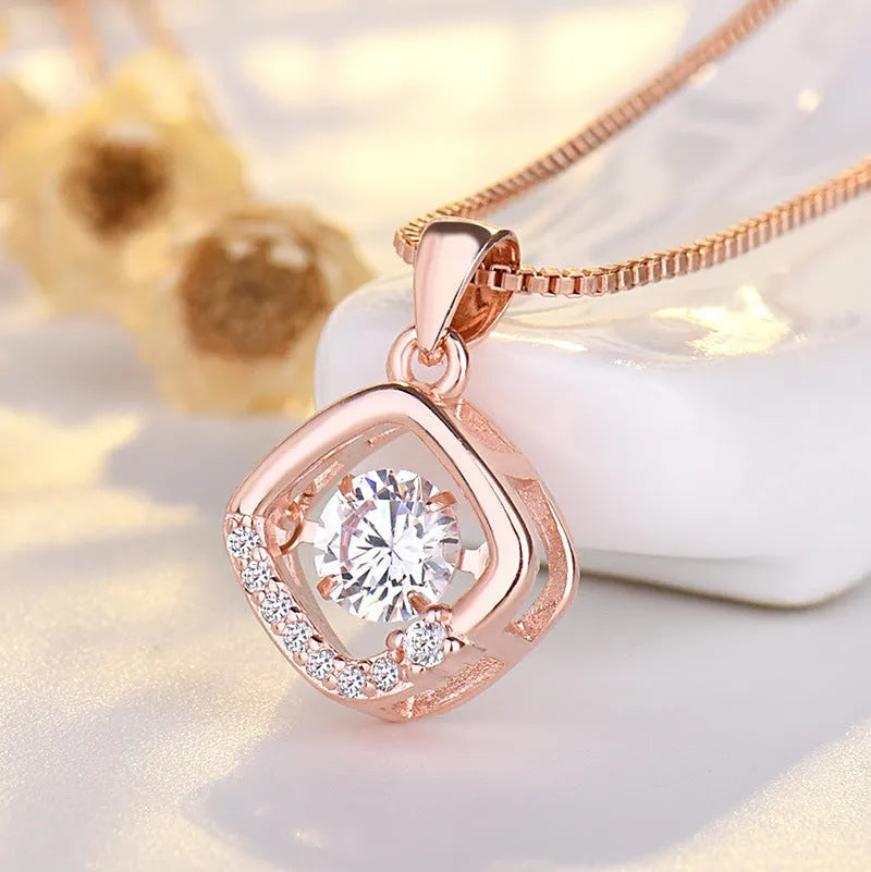 Silver heart-shaped pendant necklace with crown and bow charms for women