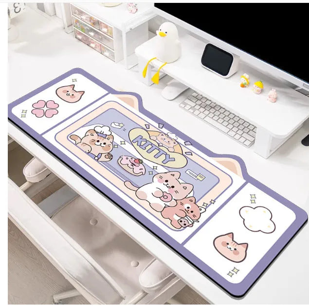 Natural rubber oversized desk pad showing pink bunny, purple bear, and purple kitten colour options