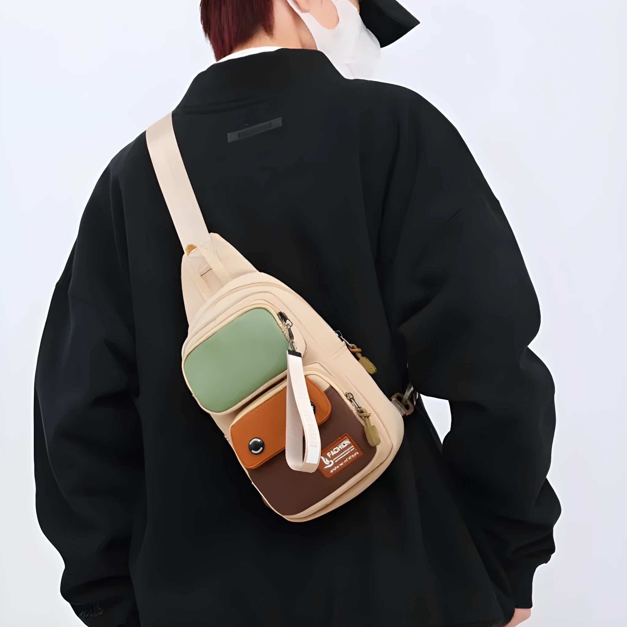 Outdoor leisure crossbody shoulder bag in nylon, shown in beige contrast colour with storage compartments.