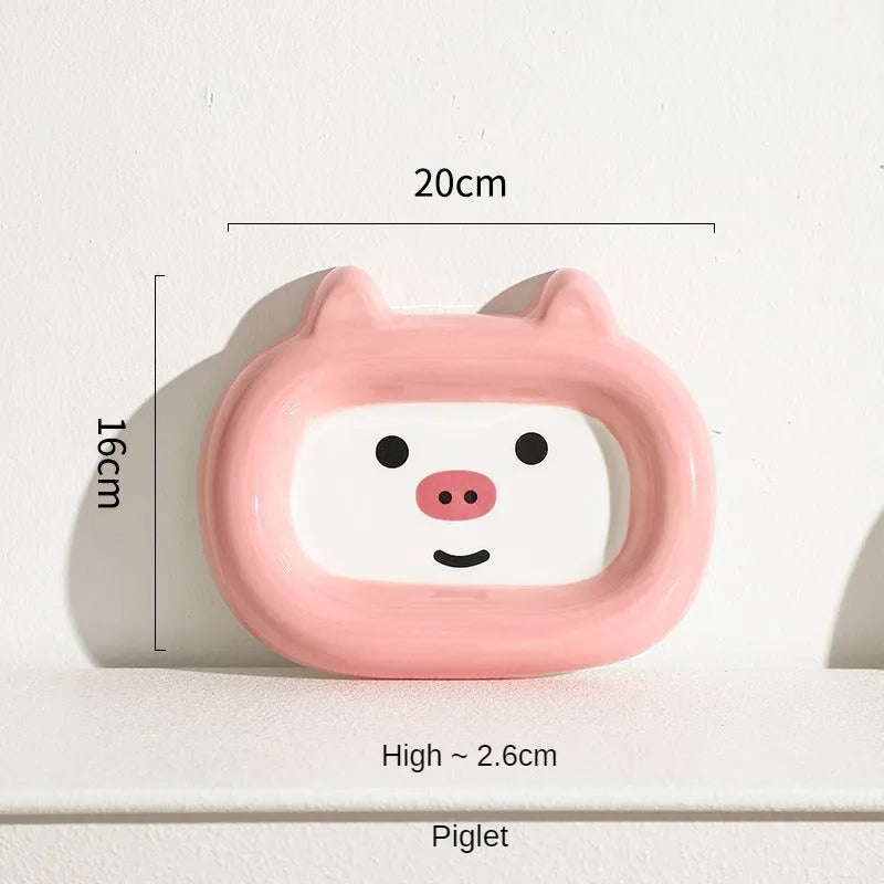 Ceramic pet bowl with an animal design, shown on a table