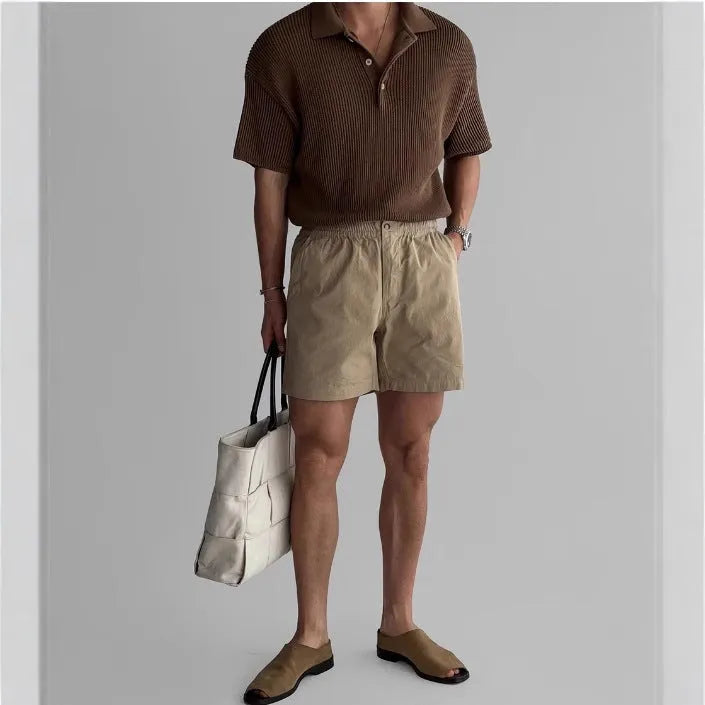 Men's cotton sports shorts in loose fit style available in black, white, and khaki colours