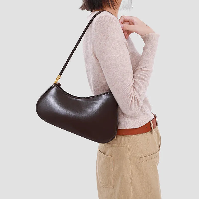 Retro oval women's underarm bag in PU leather with single shoulder strap shown in multiple colour options