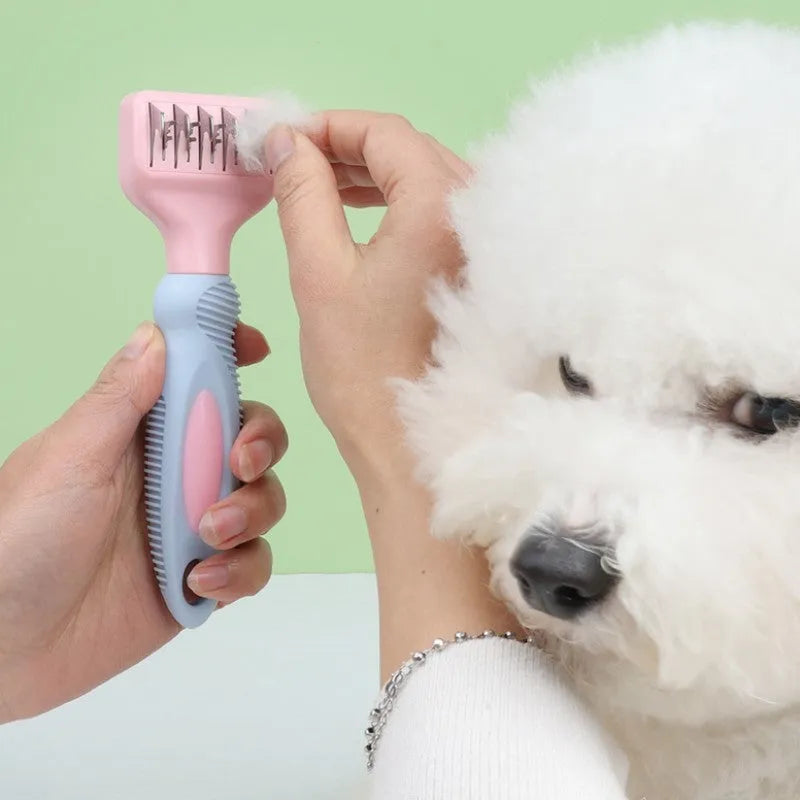 Pink pet grooming comb with stainless steel knot knife and massage brush tips measuring 170mm
