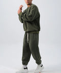 Men's polar fleece sports suit set showing crew neck top with long sleeves and matching padded trousers in winter colours