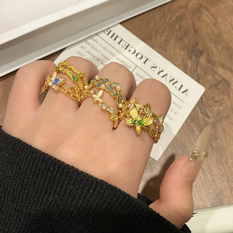 Women's butterfly design ring made from copper with an oil-drip finish, showing one of 33 colour variants.