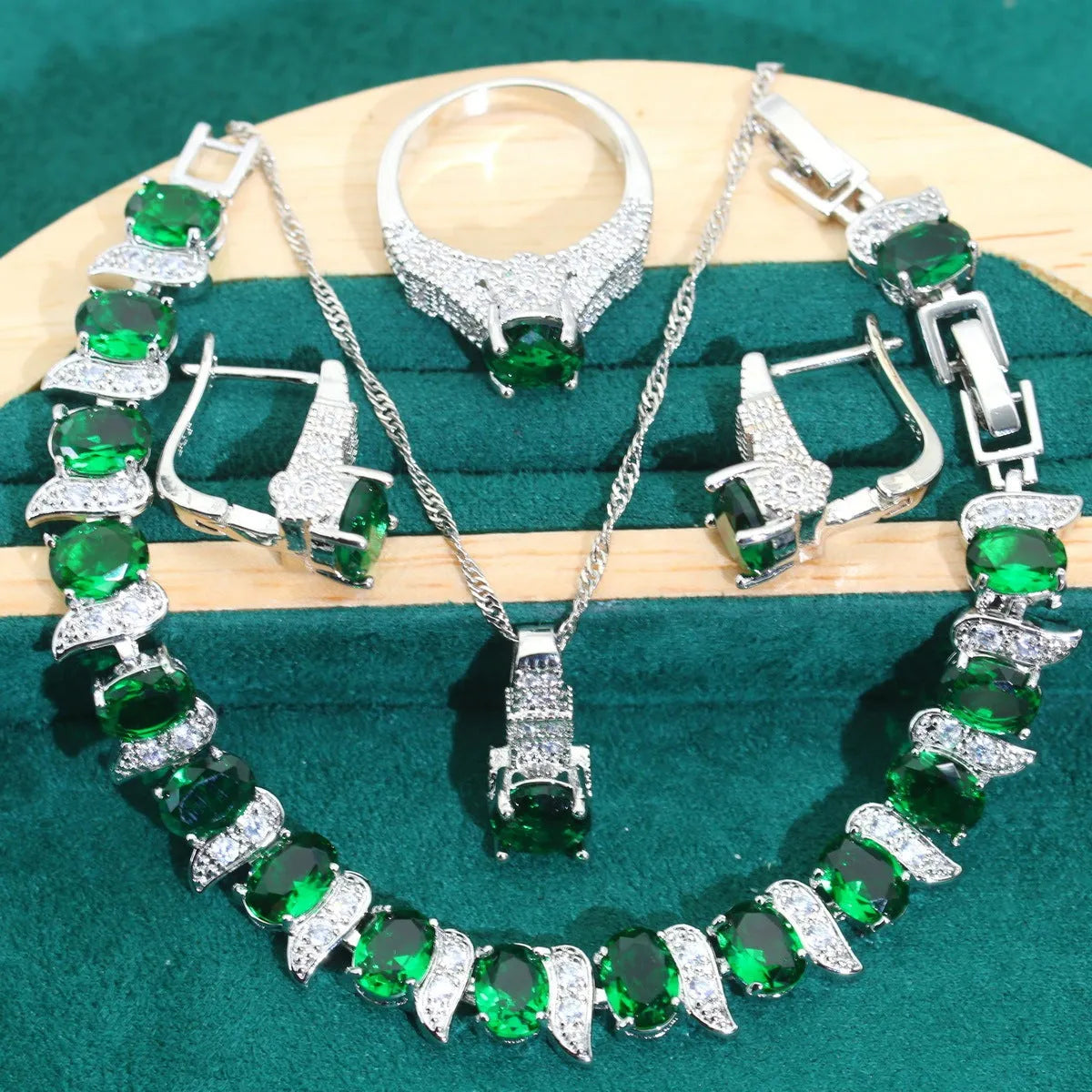 Bridal zircon jewellery four-piece set showing necklace, bracelet, earrings, and ring with water wave chain styling