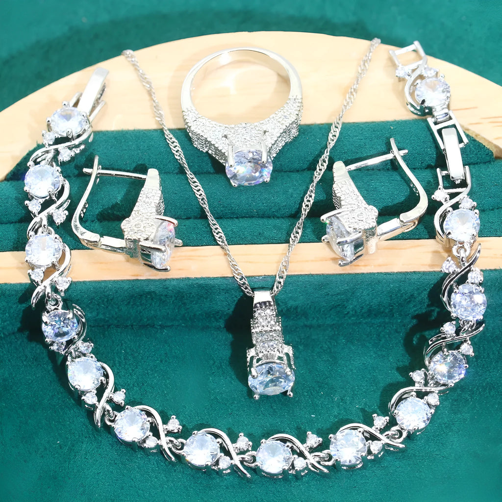 Bridal zircon jewellery four-piece set showing necklace, bracelet, earrings, and ring with water wave chain styling