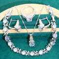 Bridal zircon jewellery four-piece set showing necklace, bracelet, earrings, and ring with water wave chain styling