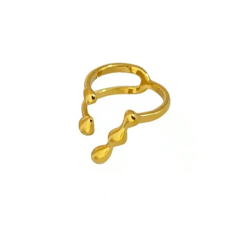 Brass opening ring in gold or silver finish with spherical design details.