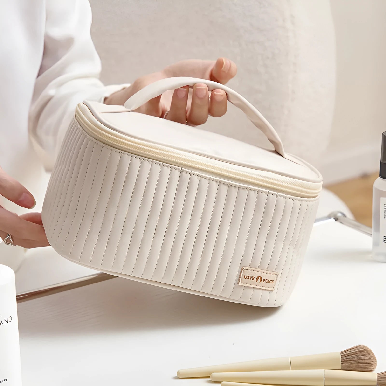 Open-top women's makeup bag in PU leather, shown in a choice of solid colours including pink, beige, and light blue.