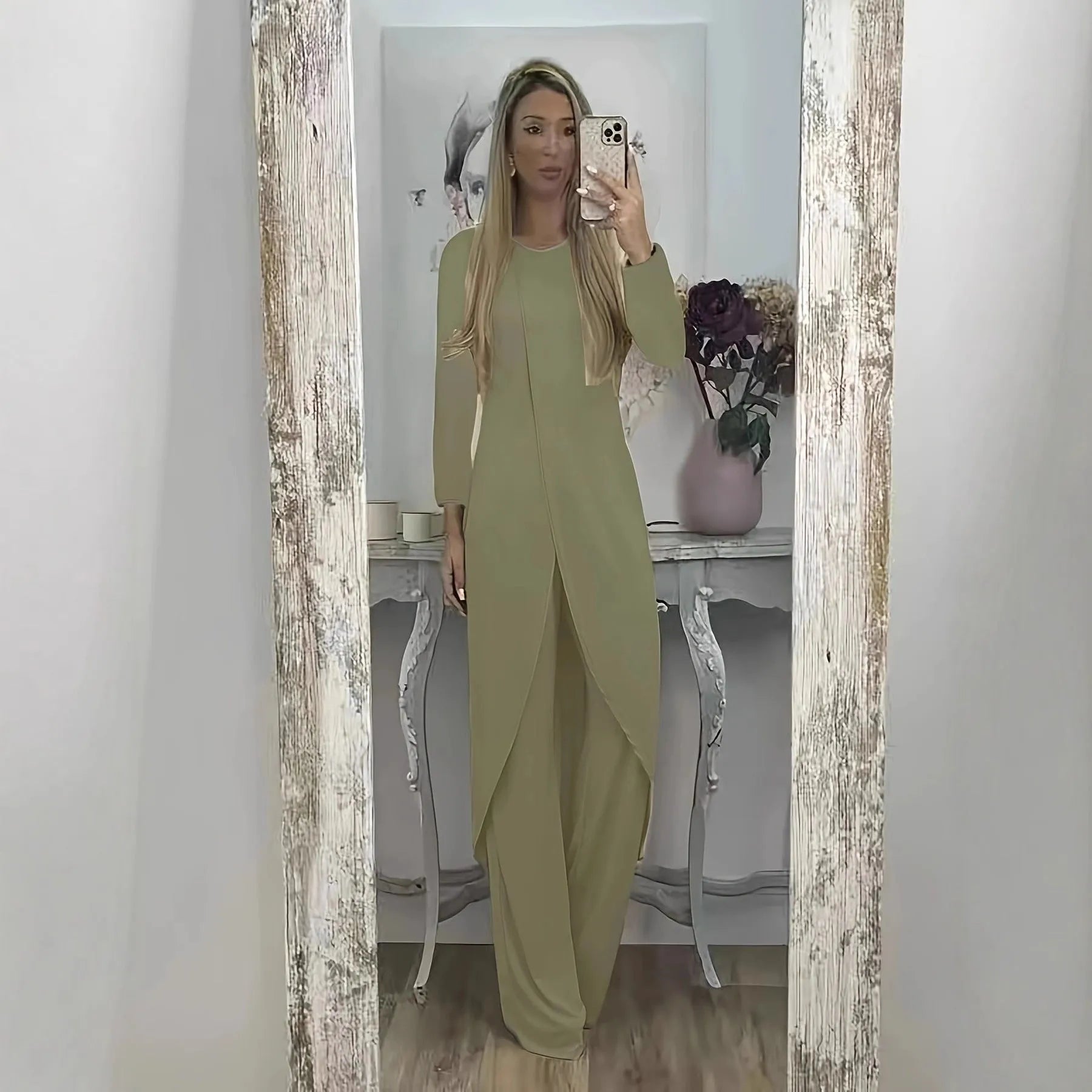 Black loose fit casual two-piece lounge set with long sleeve top and trousers on a hanger.