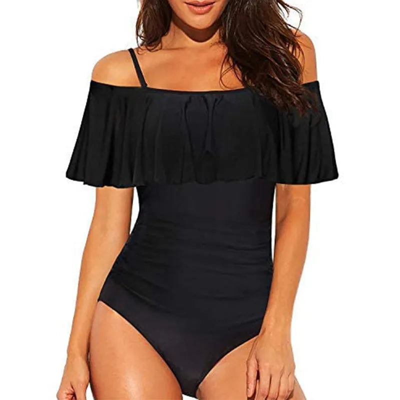 Black one-piece swimsuit with ruffled tube top straps and a cut-out design.
