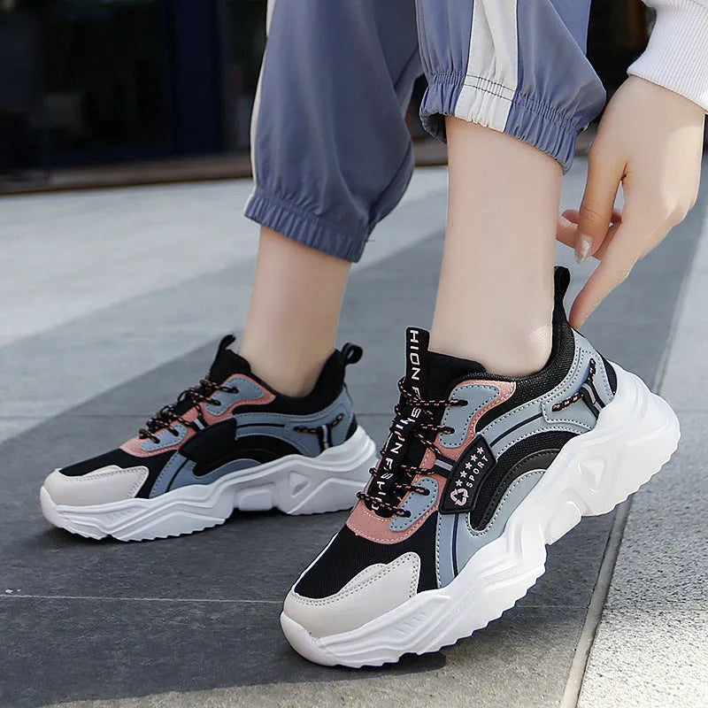 White women's casual mesh sports shoes with a buckle and thick sole.