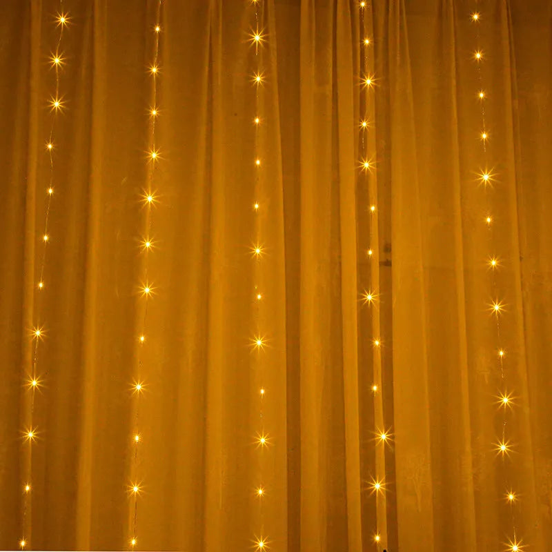 Copper curtain fairy lights with multiple LED beads, showing blue, purple, and white colour options hung in a decorative drape.