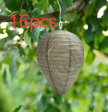 Gold beehive shaped paper lantern with honeycomb texture, shown hanging.