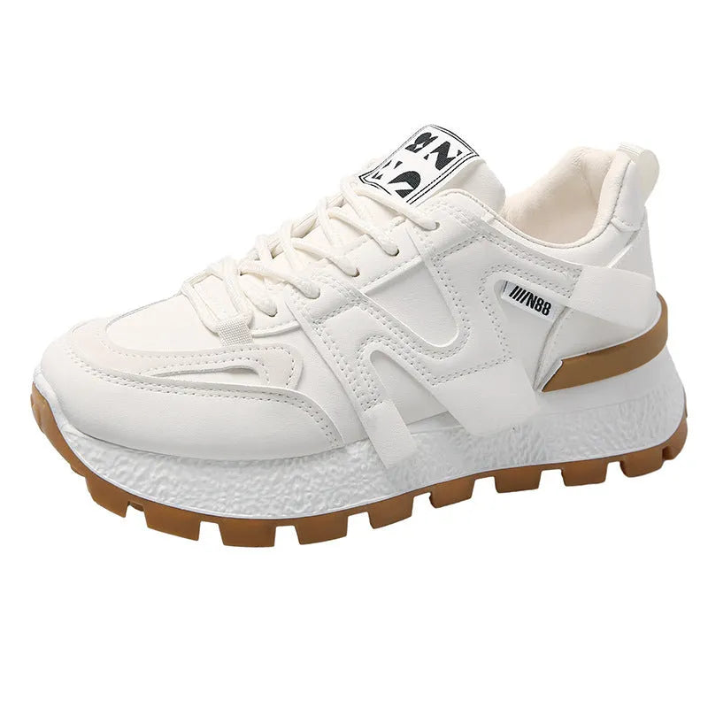 Women's low-top unisex sneaker in black or white with artificial PU upper and rubber sole