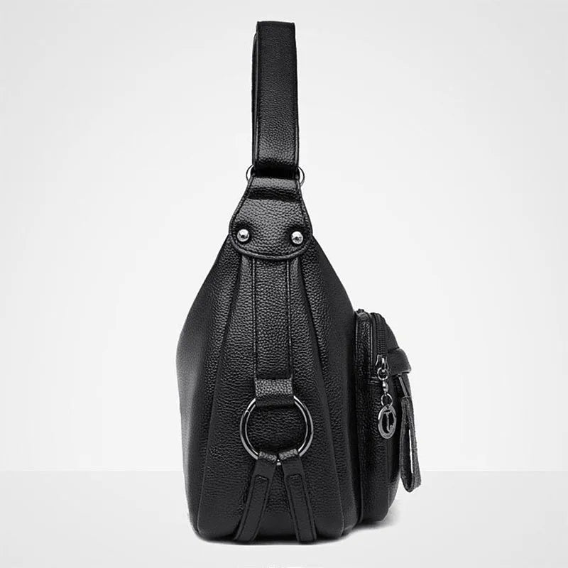 Large blue soft PU women's shoulder bag with a zipper and organised interior compartments.