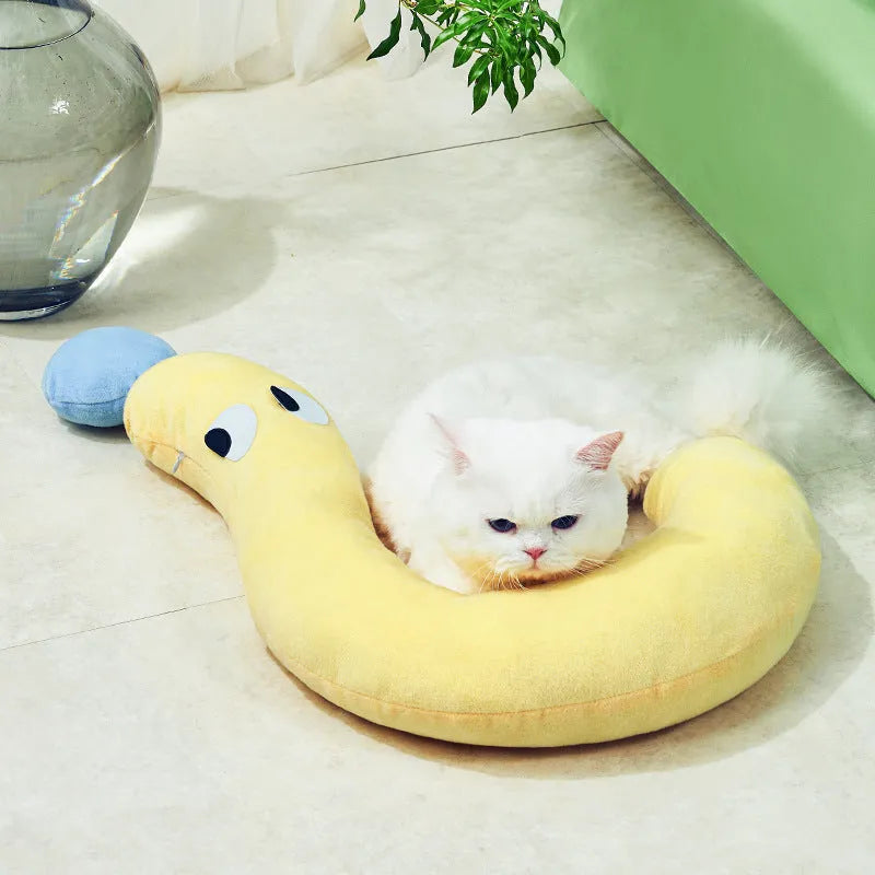 A rectangular blue or yellow pet pillow for cats and dogs, measuring 62cm by 39cm.