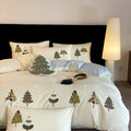 Pure cotton bedding set with embroidered Christmas trees on duvet cover, sheet, and pillowcases in cream blue or green.